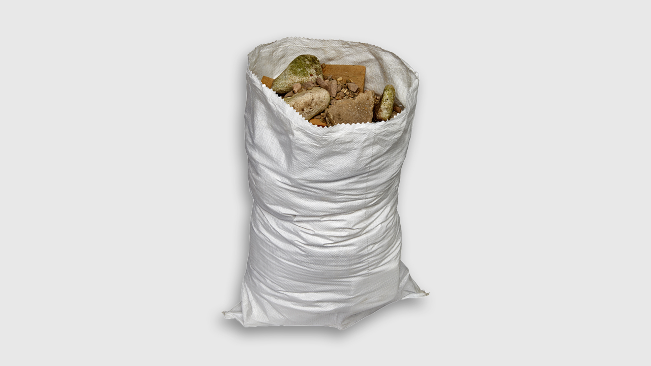 Industrial waste sack filled with various rubble