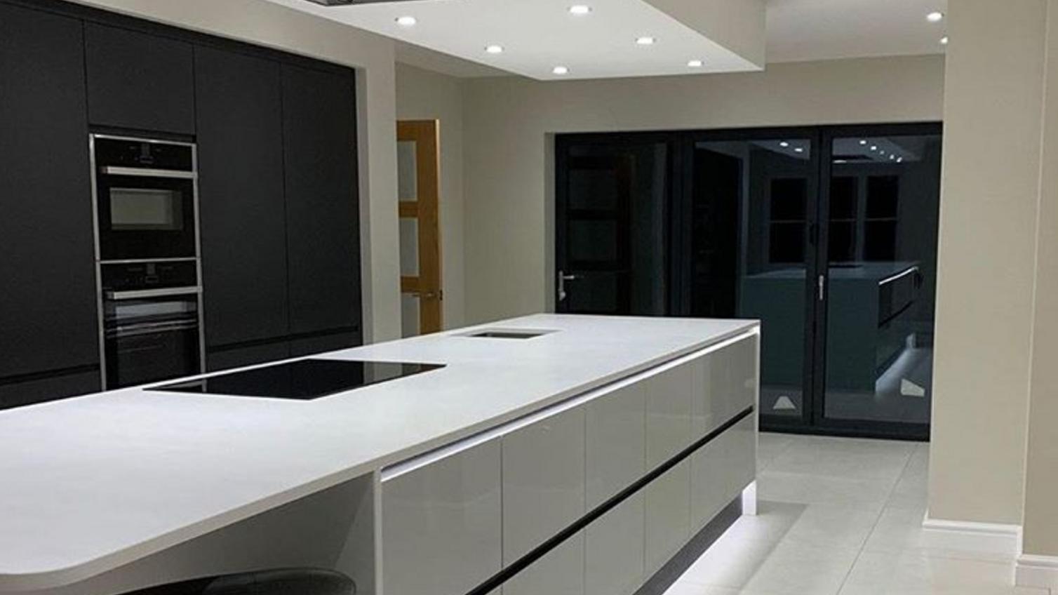 Black and grey two kitchen with linear island
