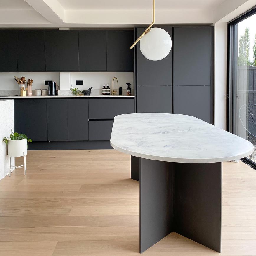Black matt kitchen with engineered wood flooring