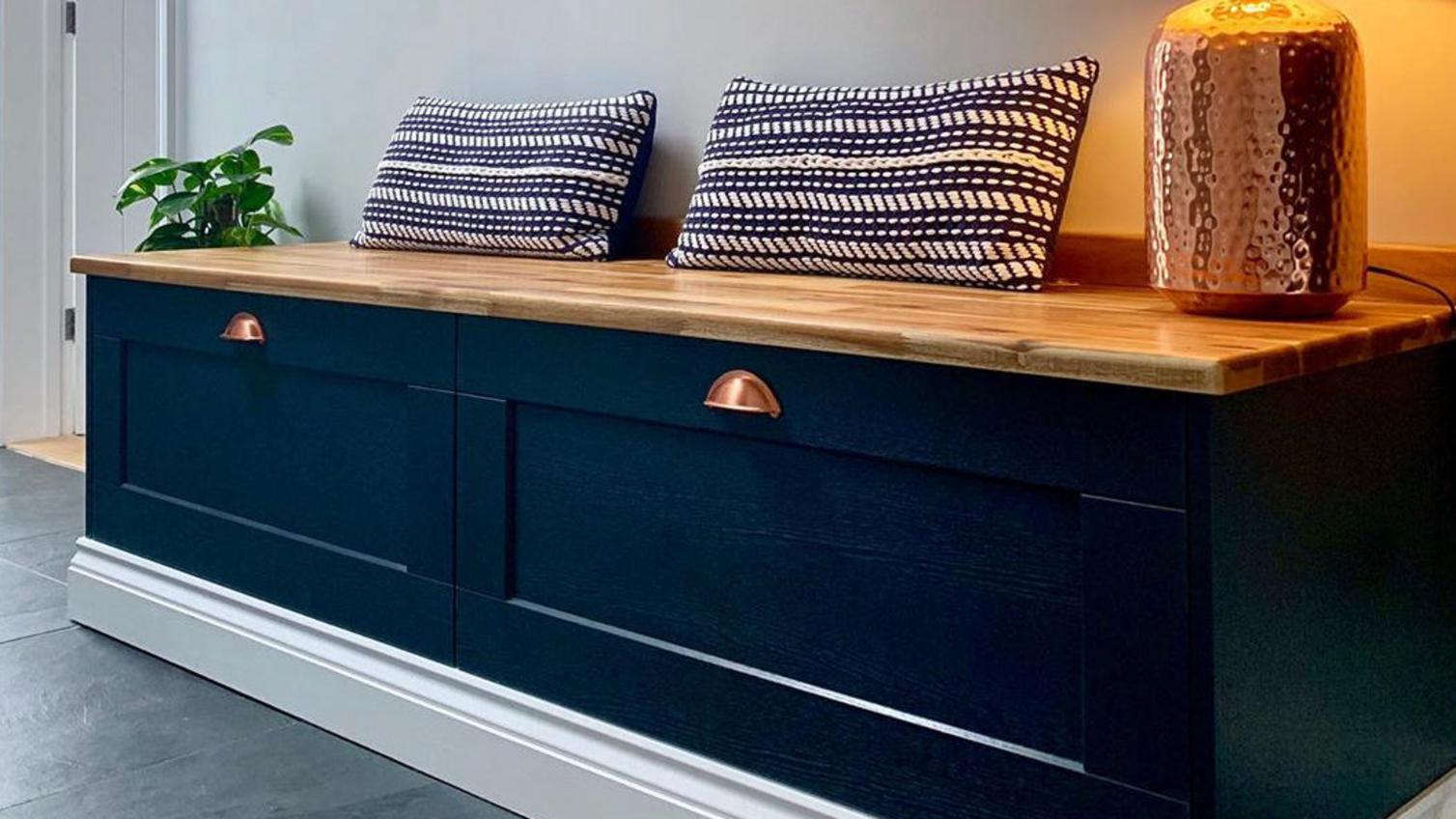 Combining deep drawers with a countertop for a boot room storage idea that creates a comfy bench.