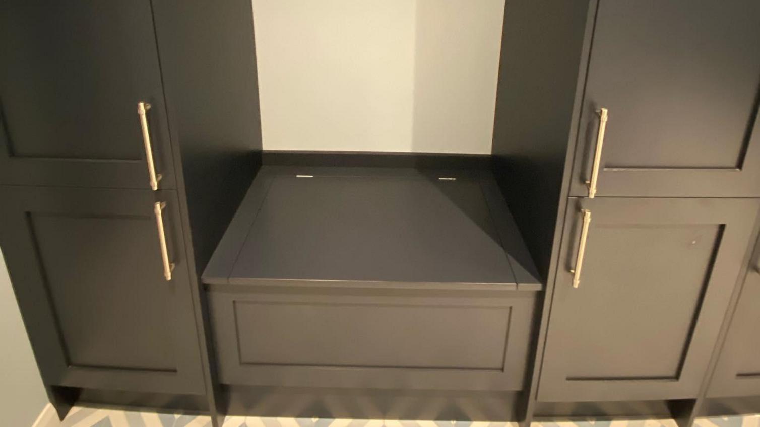 Bespoke boot room storage idea using base cabinets and a piano hinge lid for a seat with storage.