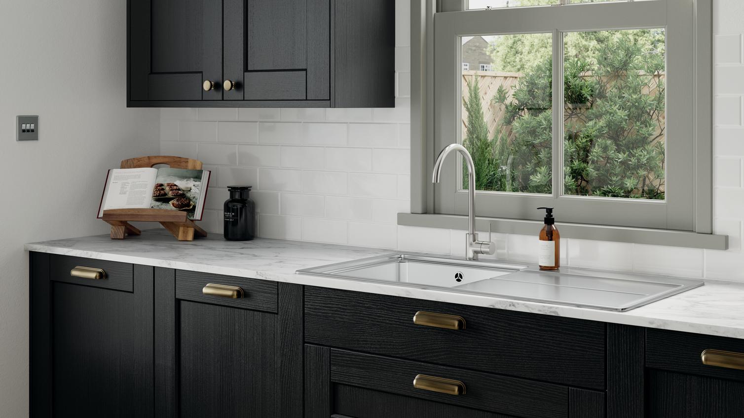 Fairford Charcoal kitchen cabinets with brass handles and grey worktop as an industrial kitchen idea
