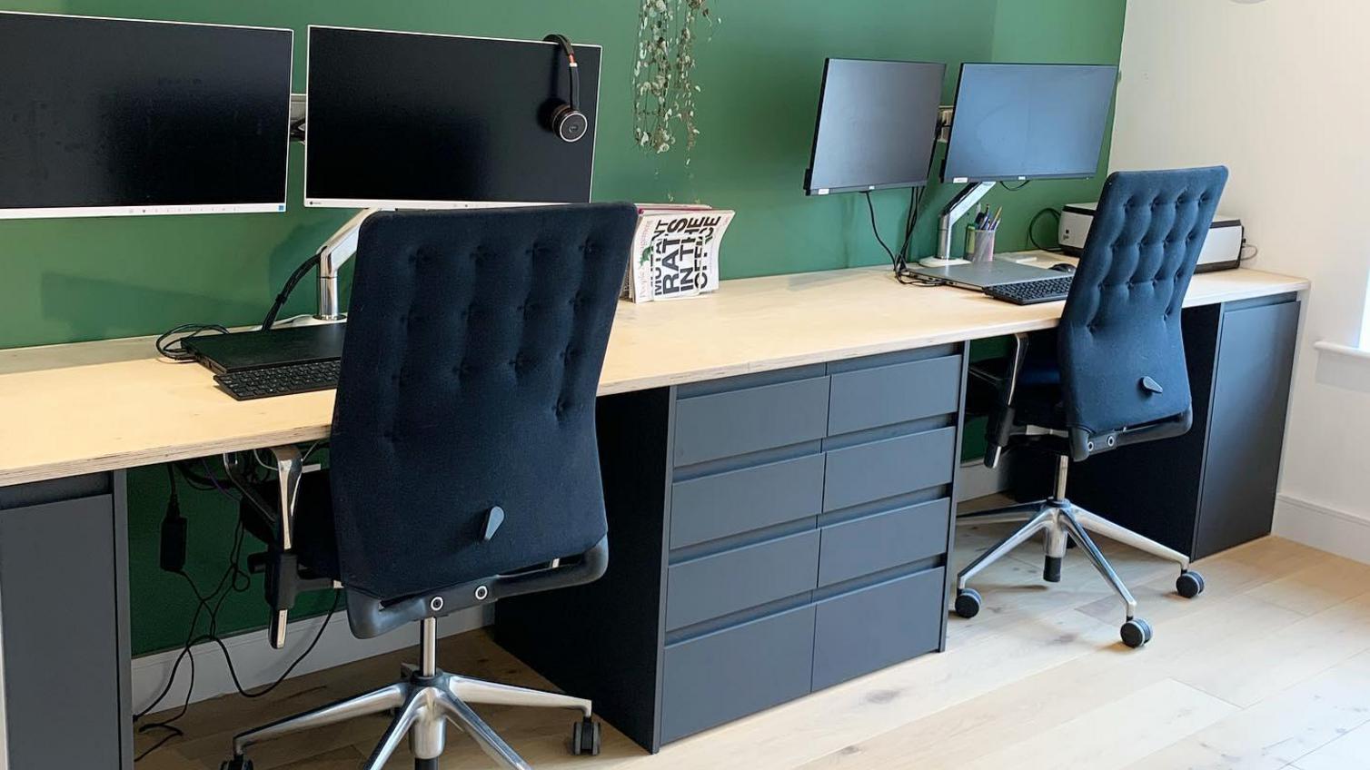 Home office idea using Clerkenwell Super Matt Charcoal cabinets and drawers, with integrated handle fronts.