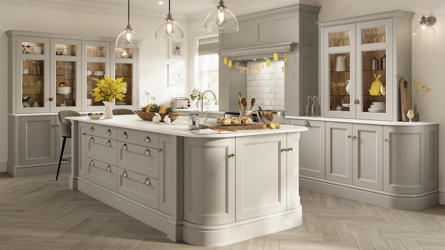 Elmbridge dove-grey kitchen design with chrome cup handles, light oak chevron floors, and Easter decorations.
