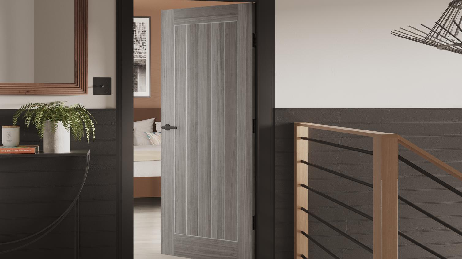 Howdens Holdenby Laminate Grey Pre-Finished Door with black hardware on a landing in a modern home, leading to a bedroom.