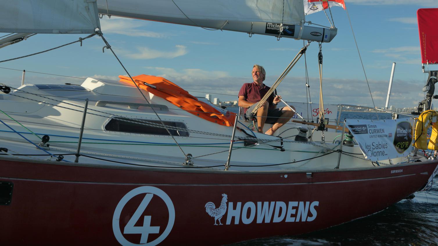 Simon Curwen on a Howdens branded boat in the Golden Globe Race