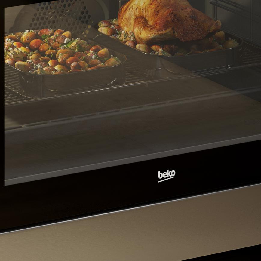 Beko freestanding cooker in a stainless steel finish.
