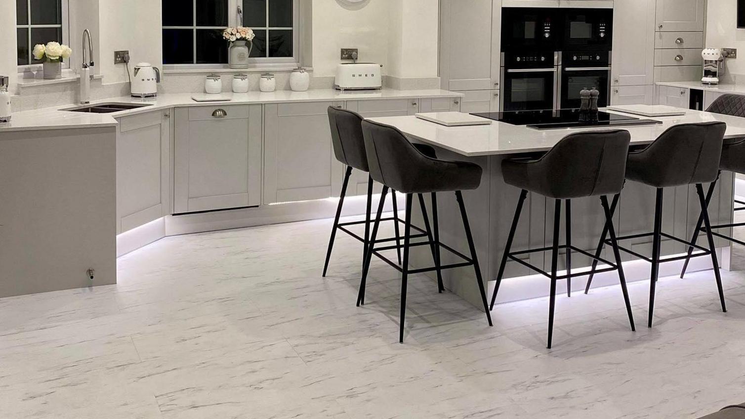 jwilsonjoineryhartlepool kitchen with Fairford dove grey cabinets, white quartz worktop, and luxury vinyl flooring.