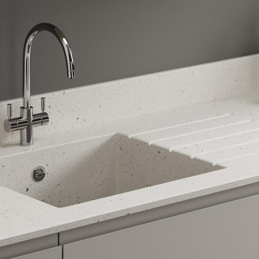 An Apollo work surface with integrated sink and a chrome hoop tap
