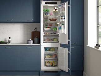 An integrated Lamona fridge freezer inside marine blue cabinetry.