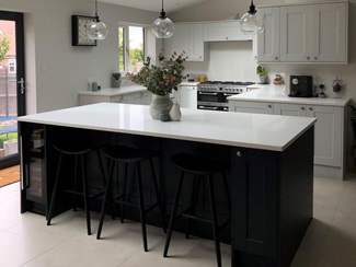 grey kitchen with navy island