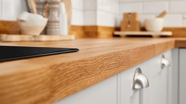 A howdens counter, with an induction hob and cooking utensils