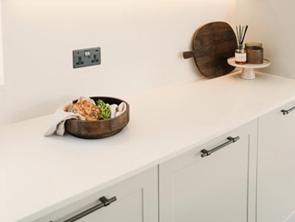 Cheryl's bespoke white worktop with timber accessories and silver shelf