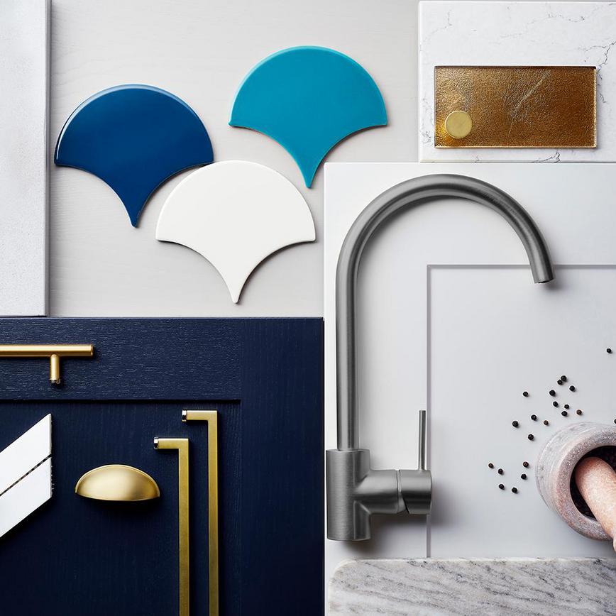 New deco kitchen trends using navy and grey doors, brushed taps and marble-effect worktops