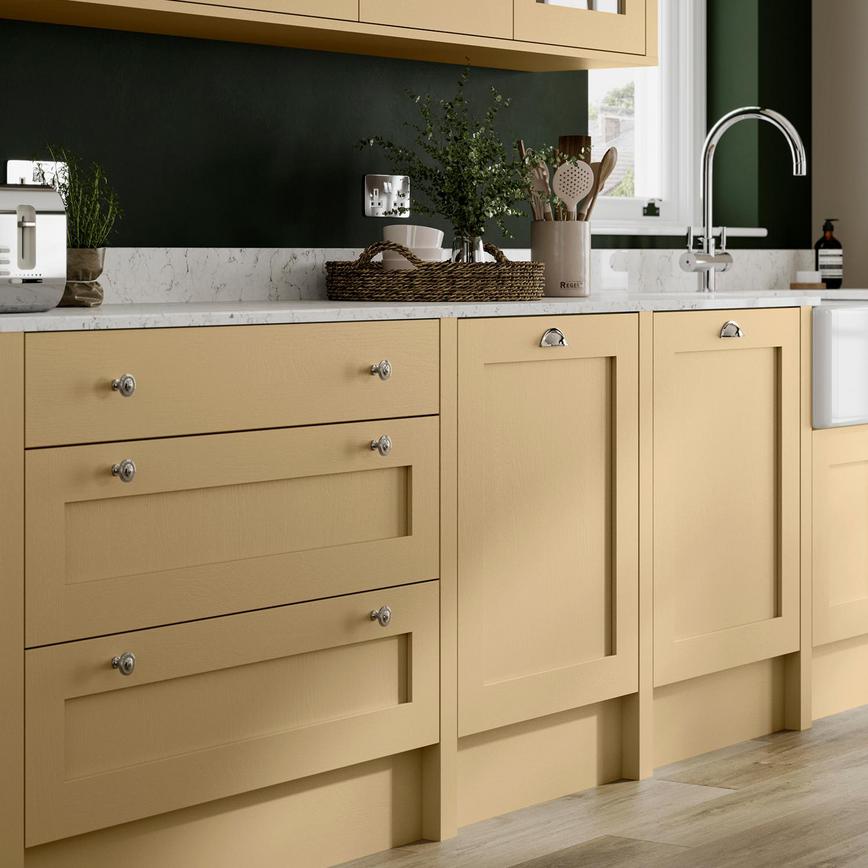 Yellow paintable kitchen idea with a shaker cupboards, silver knob handles, white marble worktop and a silver mixer tap.
