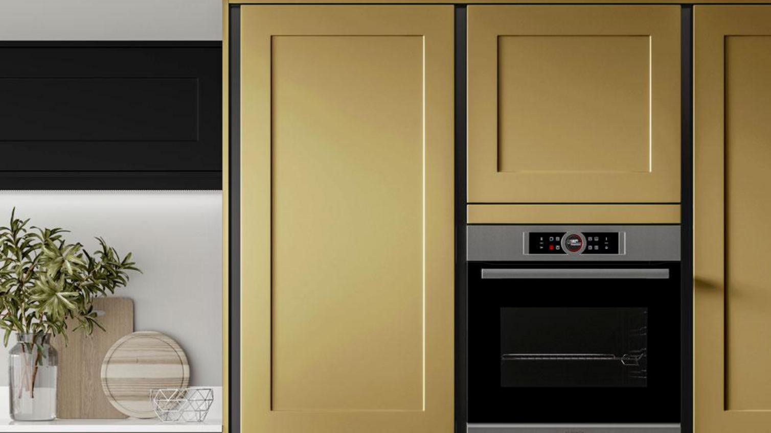 Yellow paintable kitchen idea with handleless shaker doors, black profiles, black open shelving, and white quartz worktops.