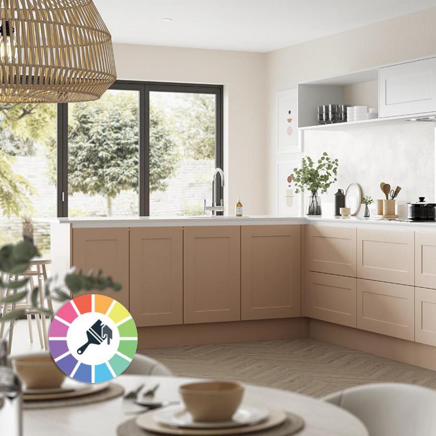 Light pink paintable kitchen idea with handleless shaker doors, light oak chevron flooring, open shelving and white worktops.