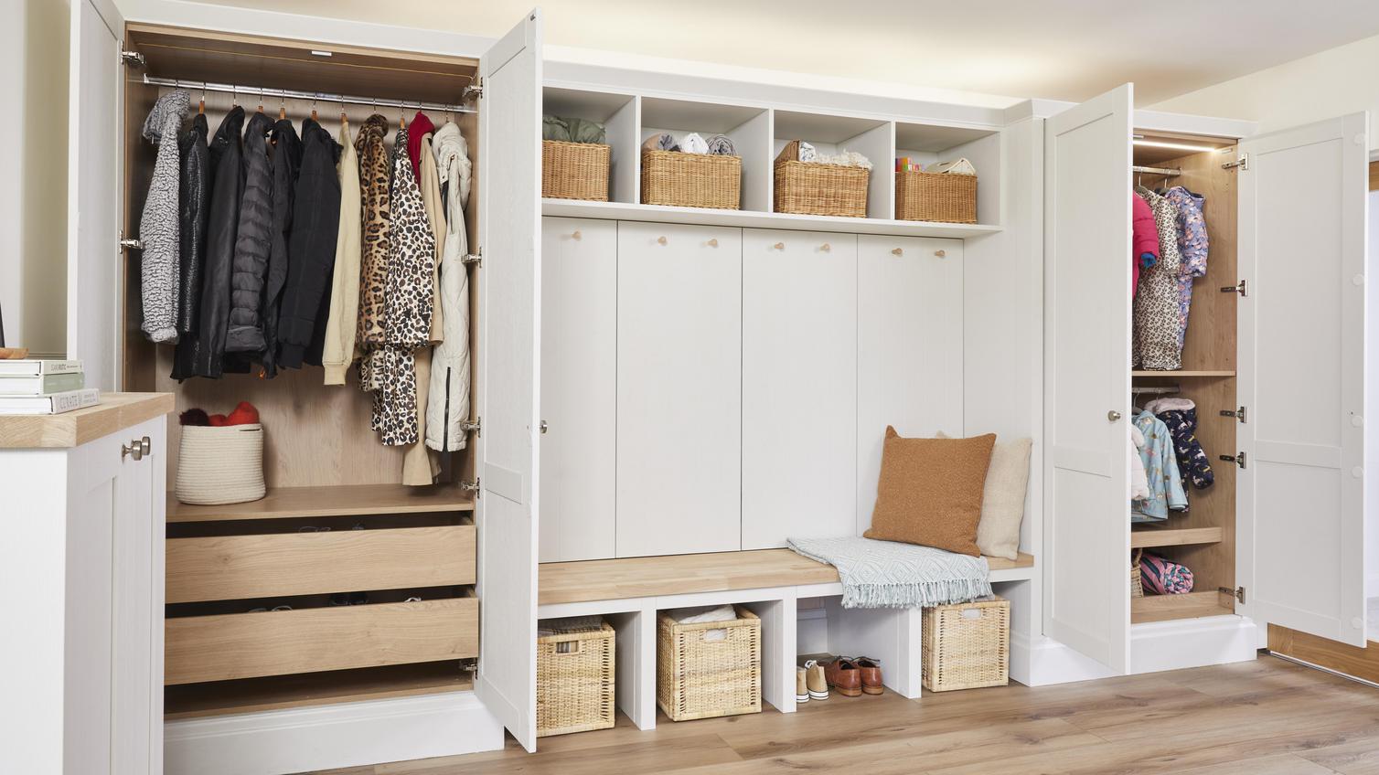 Built in storage solutions, hidden behind white cabinetry