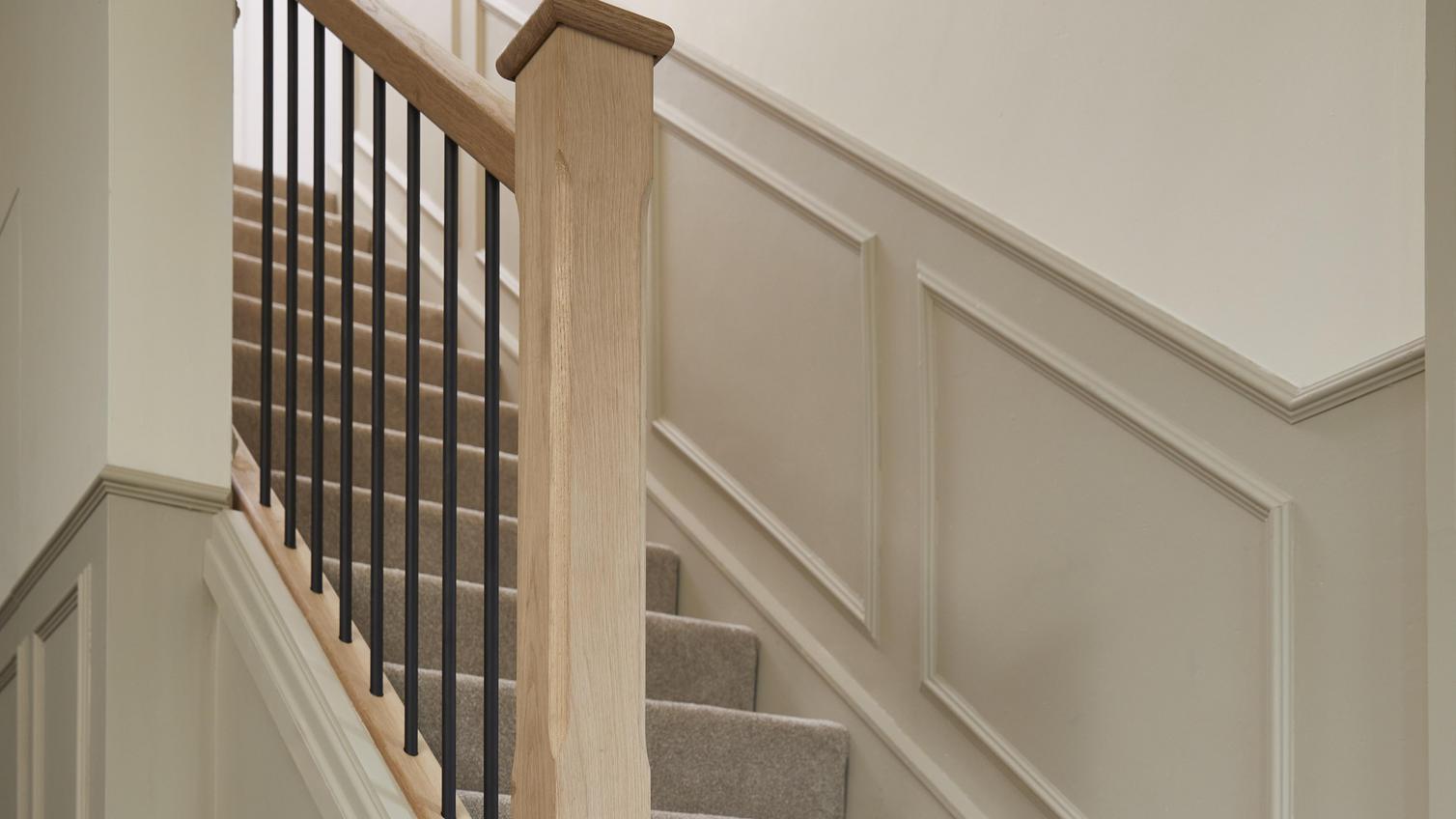 Courtney's staircase, with timber bannister and black, metal spindles
