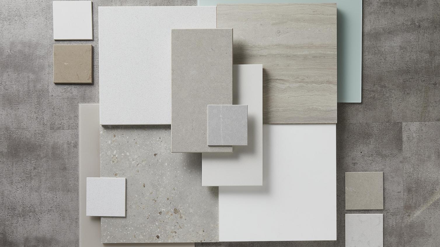 Calm haven flat lay showing light grey oak flooring, a sandstone door front,, light grey panels and textured stone slabs.