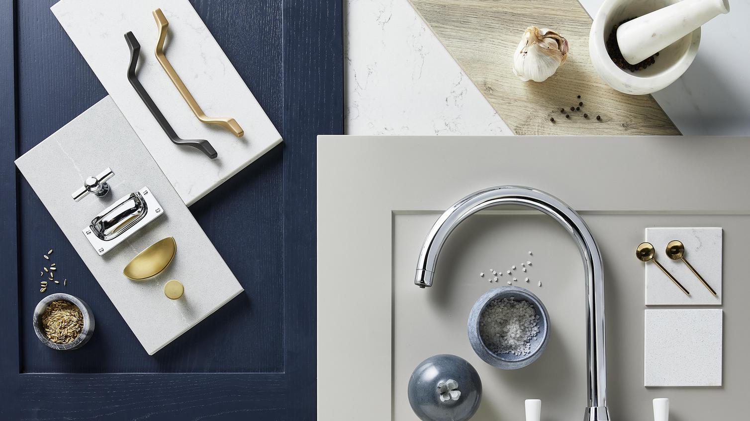 Elegance flat lay with navy and dove-grey shaker doors, brass cabinet handles, and a chrome curved tap.