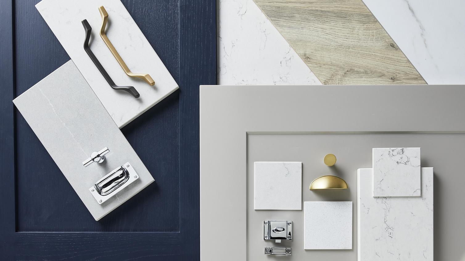 Elegance flat lay with navy and dove-grey shaker doors, brass cabinet handles, and a white marble tiles.