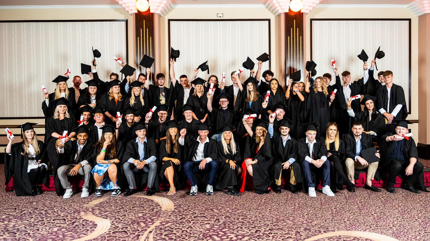 Apprentices celebrate graduating from the Howdens programme