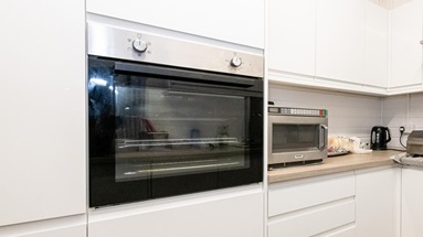 A built in stainless-steel and black oven