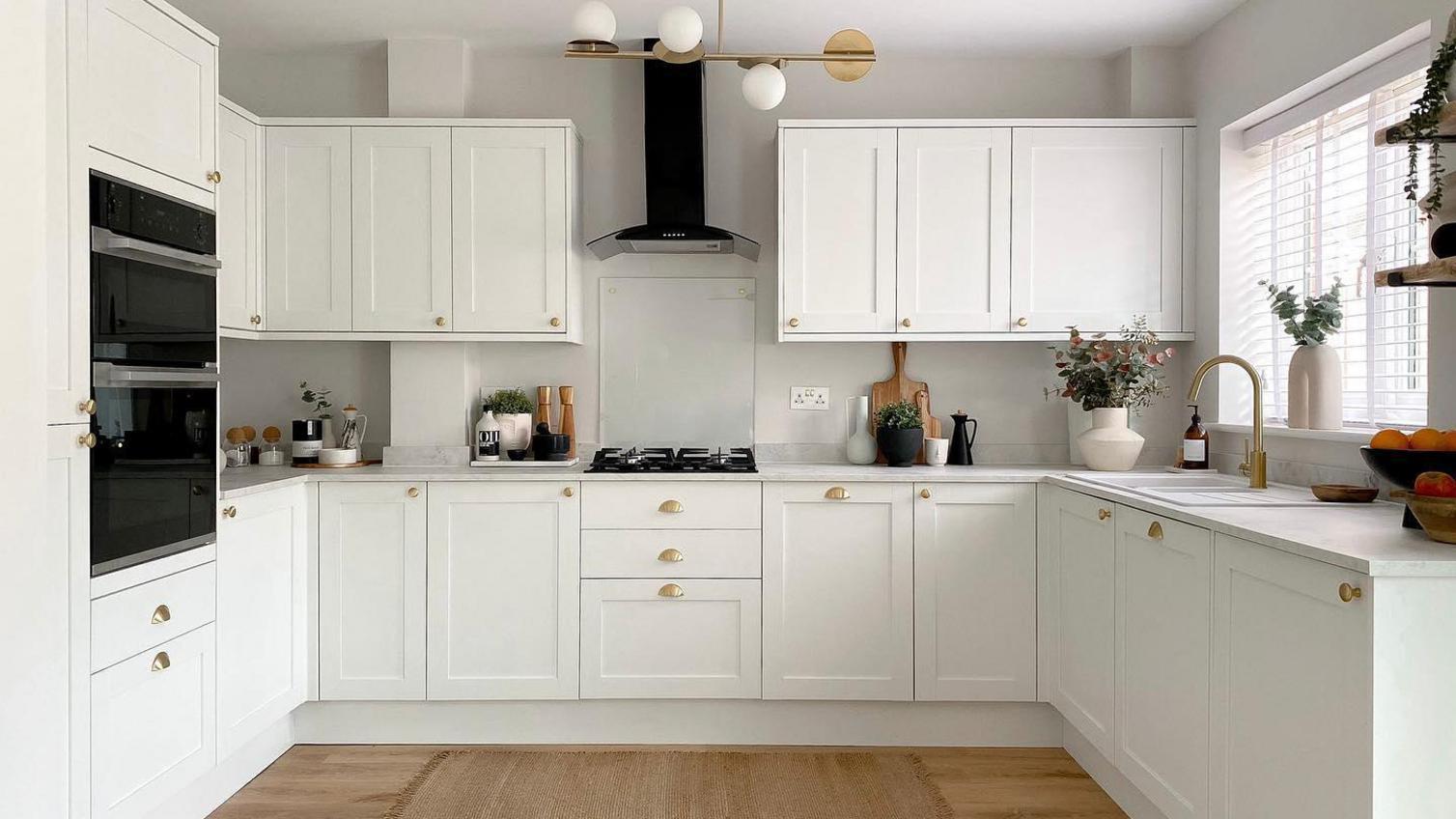 An impressive white shaker kitchen made from standard-sized cabinets