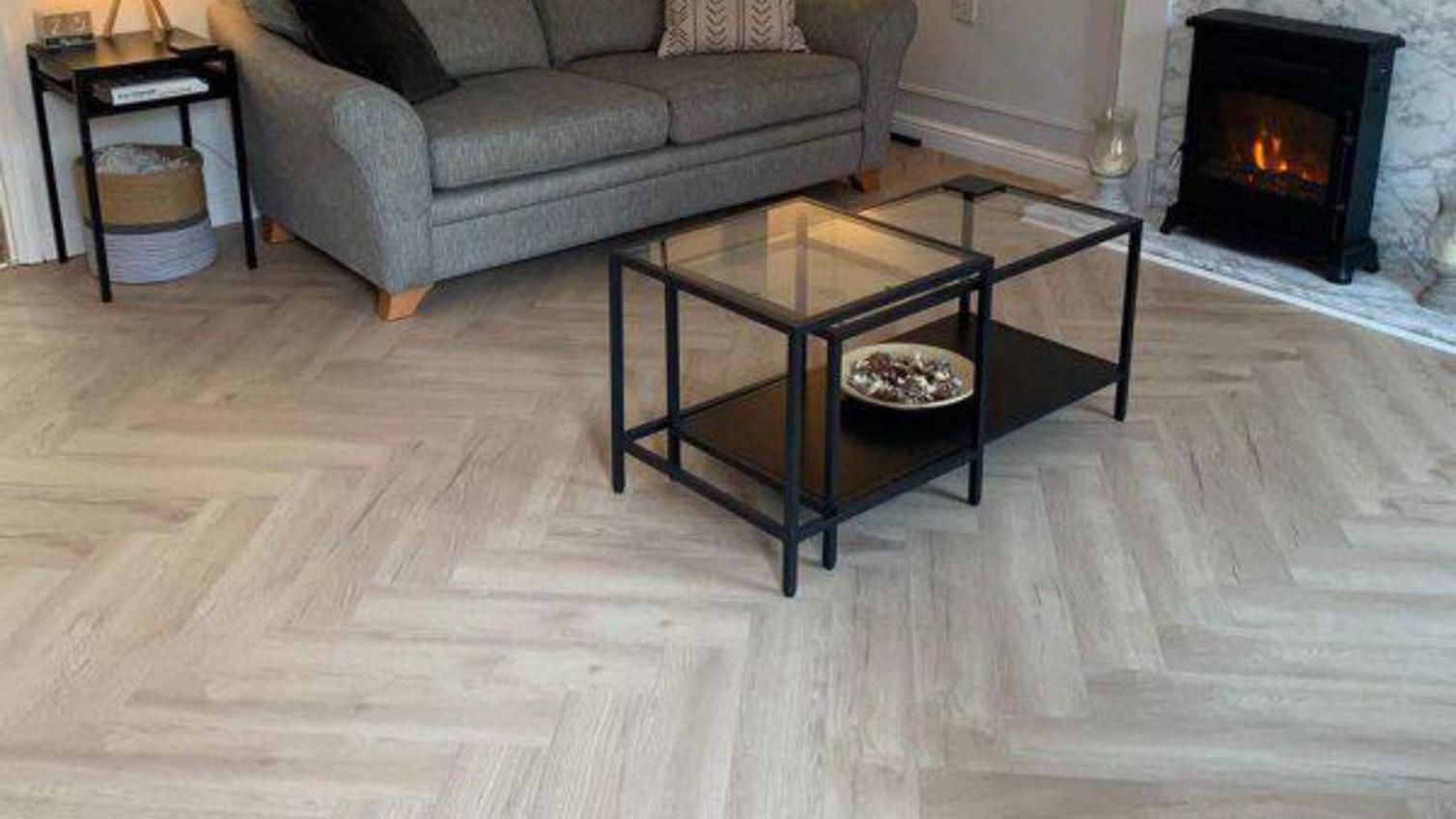 Oake and Gray herringbone vanilla oak flooring in a bright and inviting sitting room