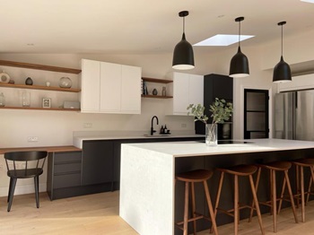 Charcoal Clerkenwell kitchen with white wall units and kitchen island