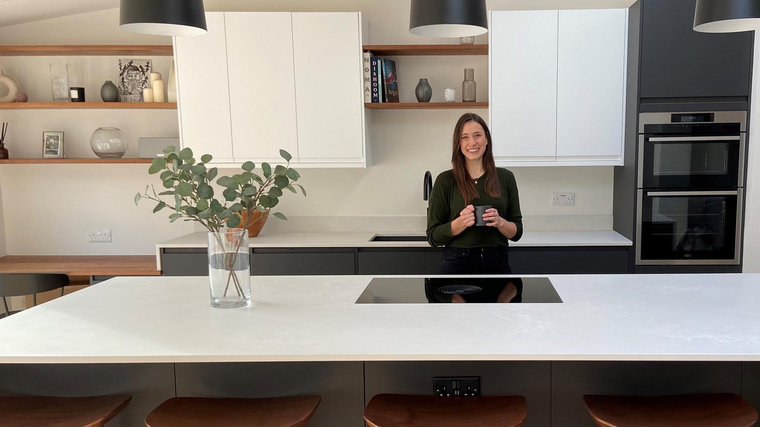 Influencer Sarah Evans in her charcoal and white Clerkenwell kitchen with island