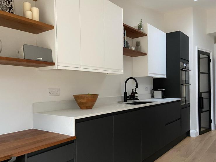 Clerkenwell kitchen with charcoal units and white wall cupboards
