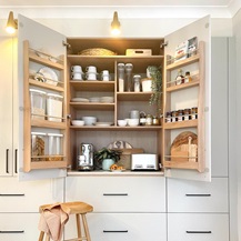 Larder storage in a cream slab kitchen