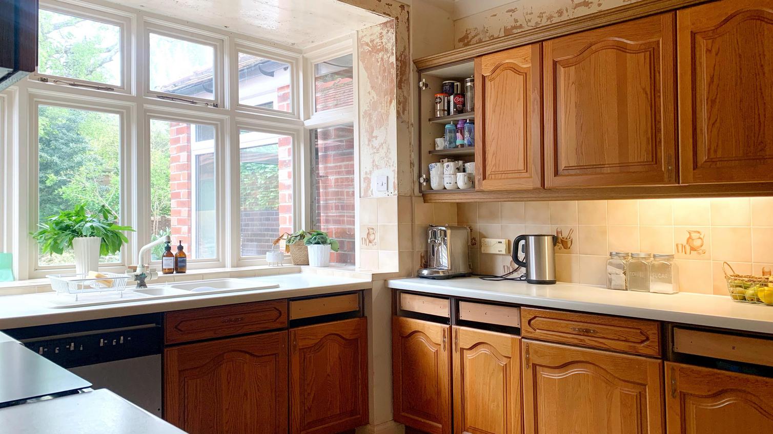 Oak shaker style kitchen with white worktops