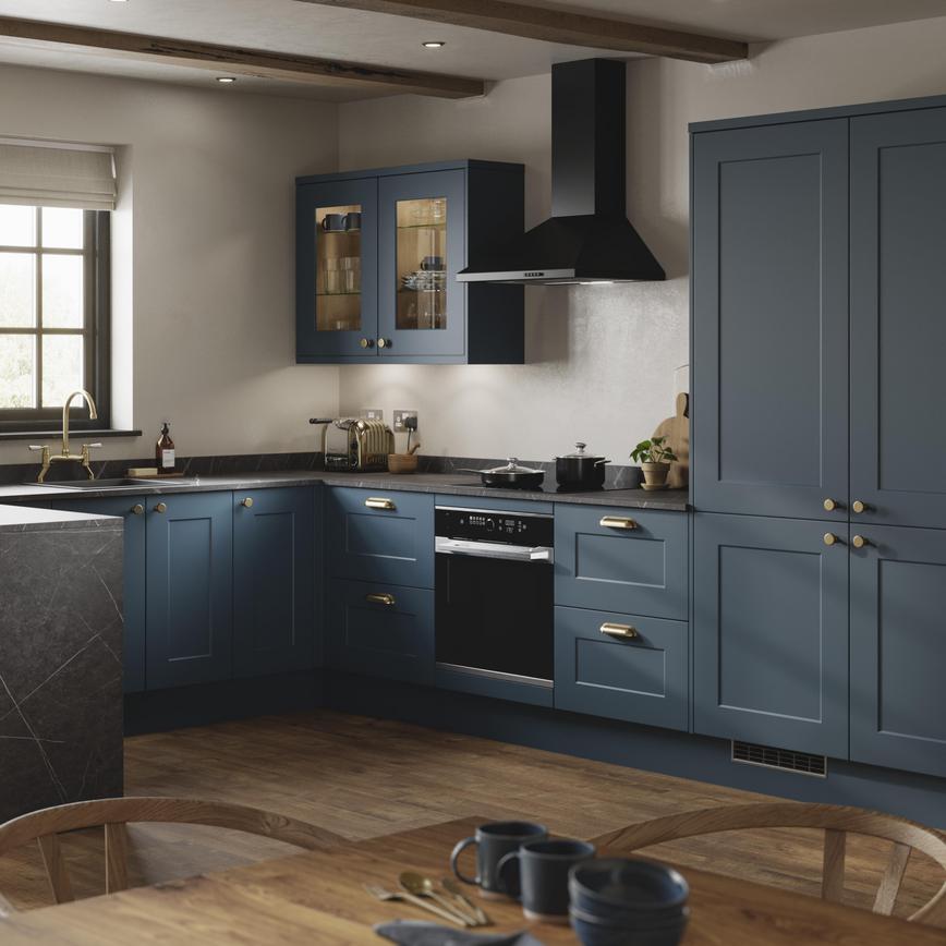 Modern marine blue kitchen with shaker door fronts and a smooth, matt finish. Includes black bar-handles and a white worktop.