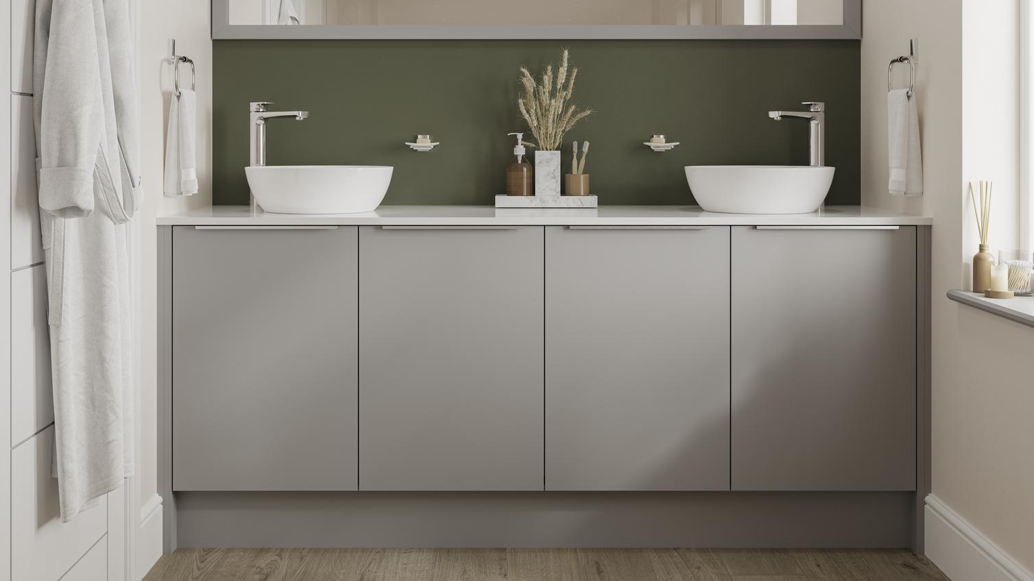 Compact grey bathroom with slab doors in a smooth finish. Includes trimline handles, a white worktop, and dark timber floor.