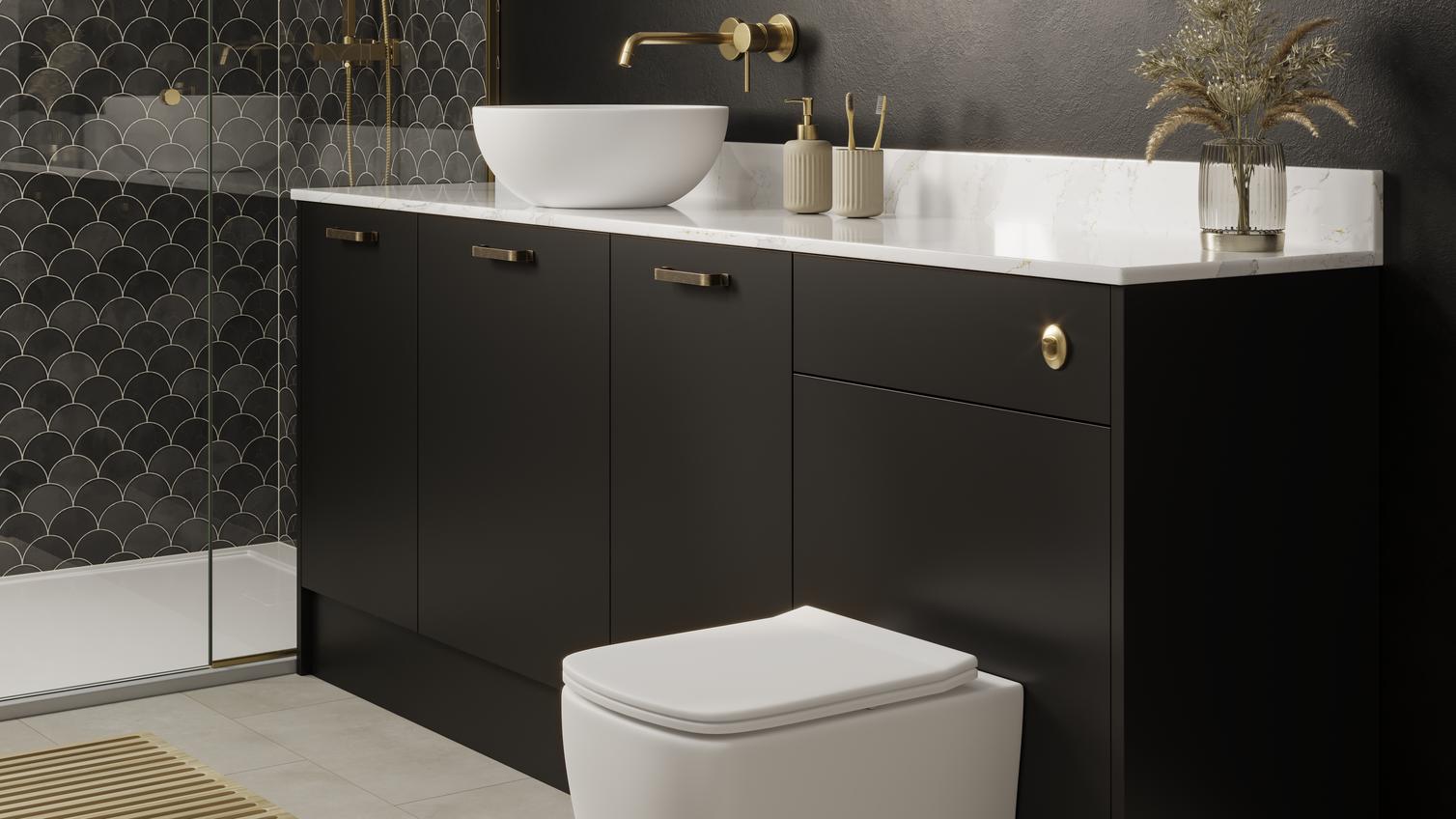 A Hockley black bathroom with a toilet, sink, and shower. A white worktop sits on top of black vanity cabinets and cistern unit.