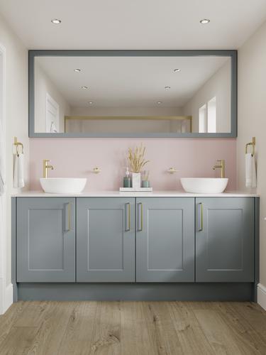 Small shaker bathroom with dusk-blue cupboard doors. Has a white worktop, oak floors, and brass handles for a luxe touch.