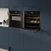 Neff N70 Slide & Hide Pyro Oven, Compact Micro Oven and Warming Drawer Open in Hockley Marine Blue Kitchen