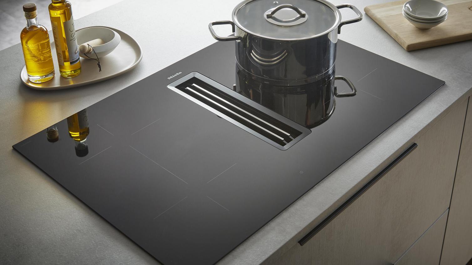 Miele Vented Induction Hob with Pan Angled View