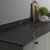Kintsugi Marble Compact Laminate Worktop on Croft Grey Cabinets with Black Knobs