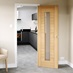 Daytona Oak Glazed door leading to a kitchen