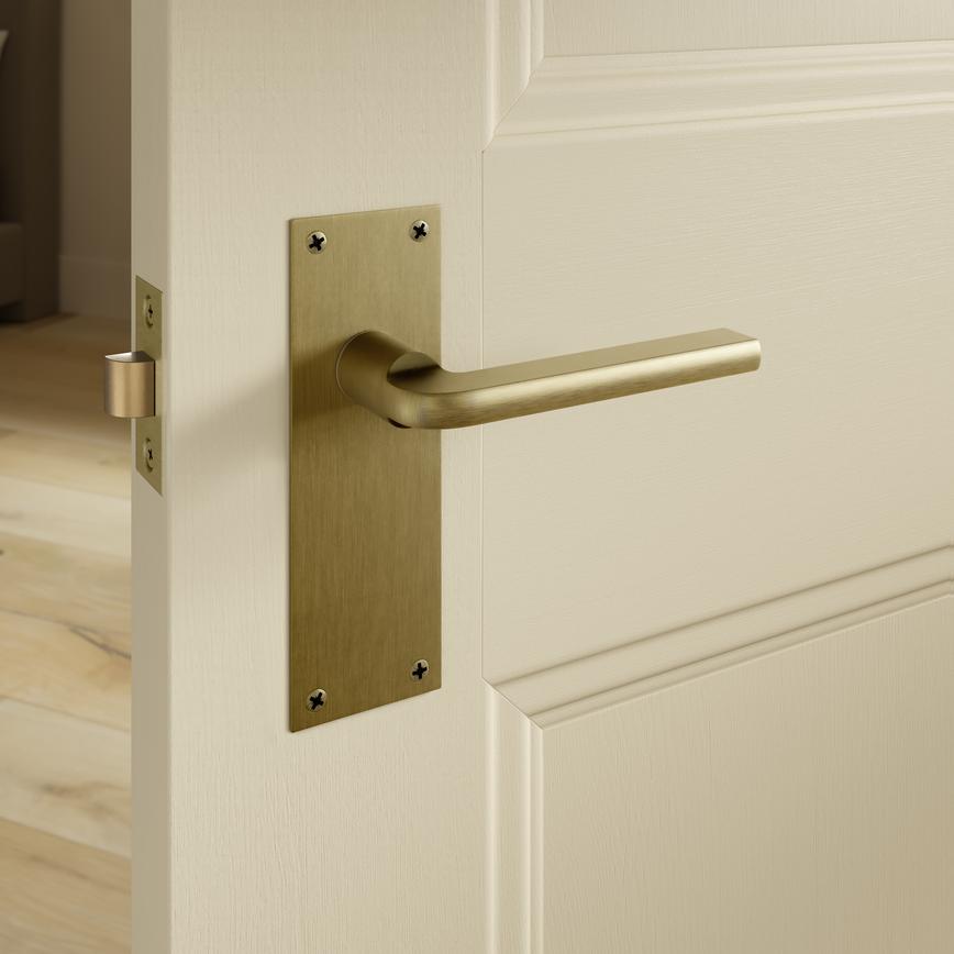 Munch Antique Brass Lever on Slim Backplate Latch Door Handle Pair