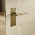 Munch Antique Brass Lever on Slim Backplate Latch Door Handle Pair