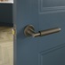 Iseo Satin Bronze Knurled Lever on Rose Door Handle Pair