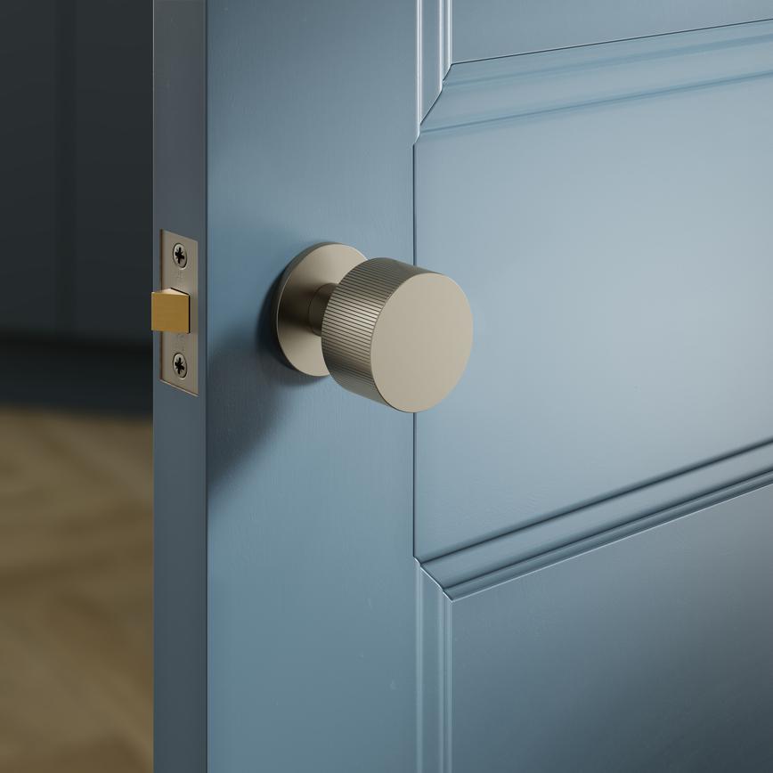 Fuller and Forge Orta Satin Bronze 50mm Fluted Round Mortice Knob on Slim Rose Pair Situational Image