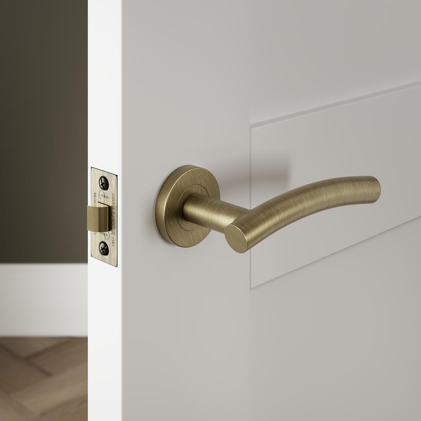 Turin Antique Brass Fire Rated Lever on Rose Door Handle Pair