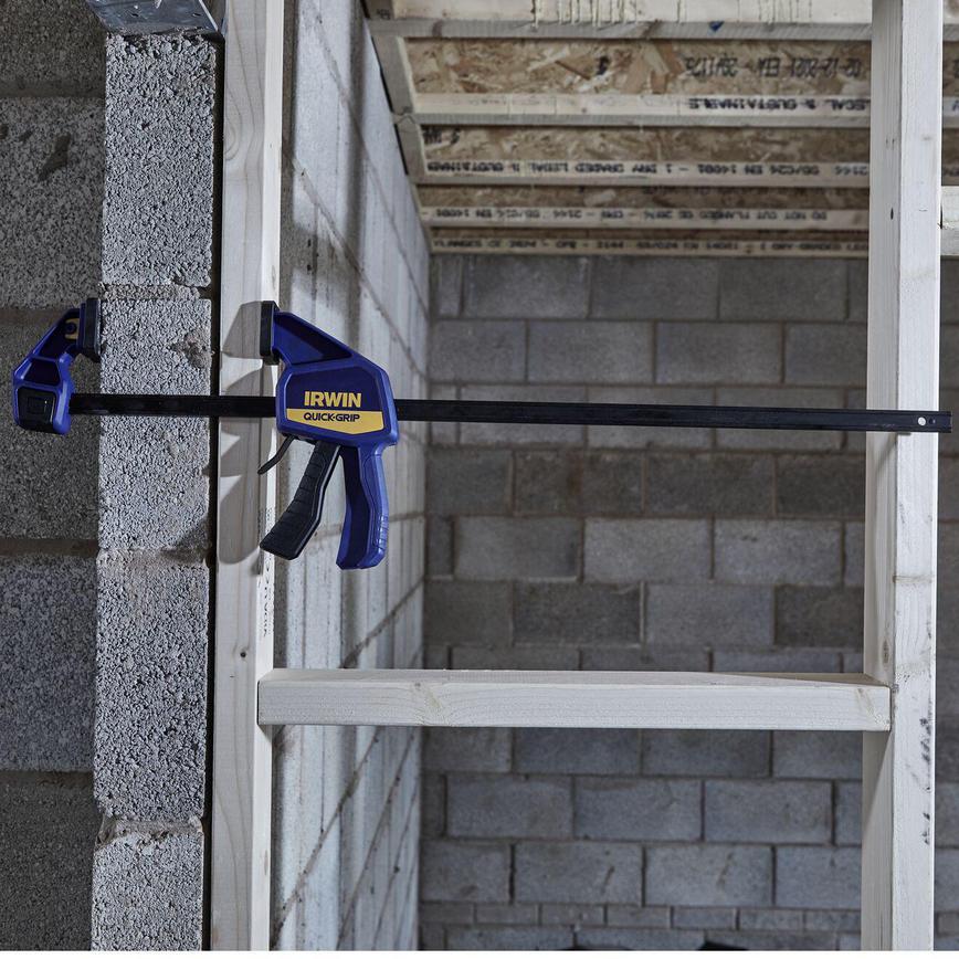 Irwin Quick-Grip 24" Medium Duty Bar Clamp Holding Wood to Breeze Block