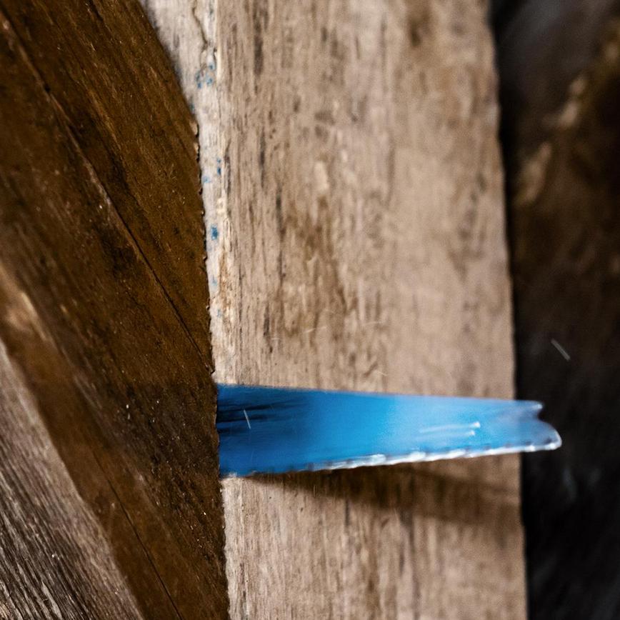Bosch Reciprocating Saw Blade cutting through wooden joist
